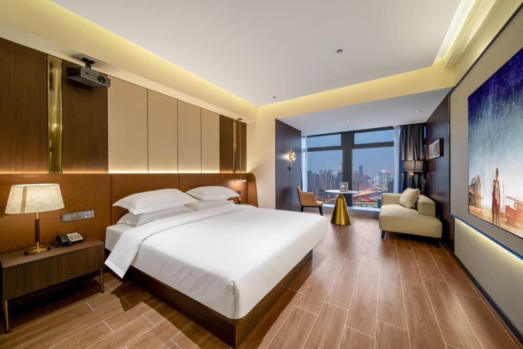 Postel nebo postele na pokoji v ubytování Chongqing Junsheng Yunduan Riverview Hotel