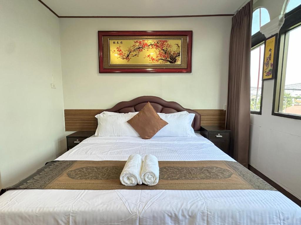 Postel nebo postele na pokoji v ubytování Longzhu Guesthouse