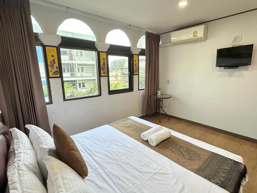Postel nebo postele na pokoji v ubytování Longzhu Guesthouse