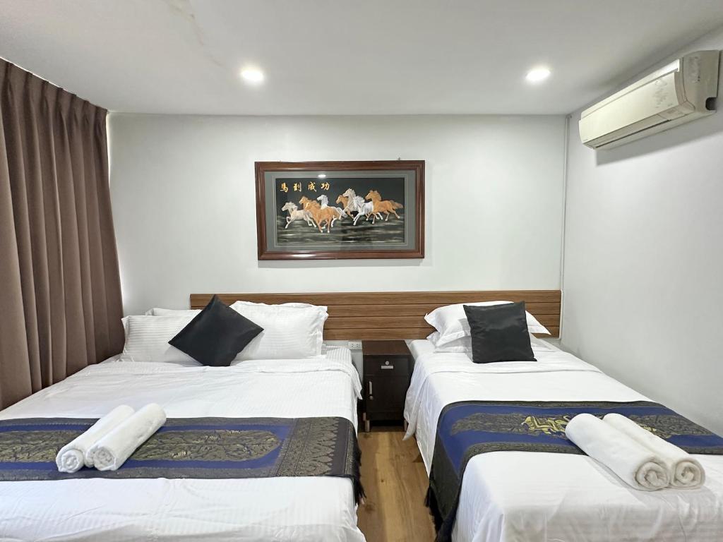 Postel nebo postele na pokoji v ubytování Longzhu Guesthouse