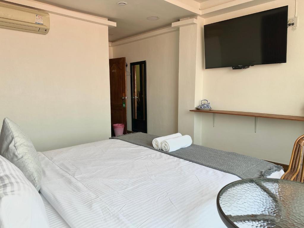 TV a/nebo společenská místnost v ubytování Longzhu Guesthouse