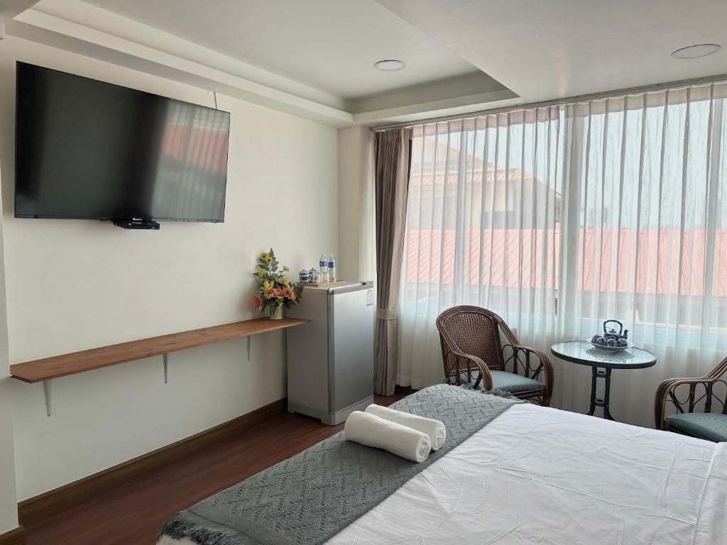 Postel nebo postele na pokoji v ubytování Longzhu Guesthouse