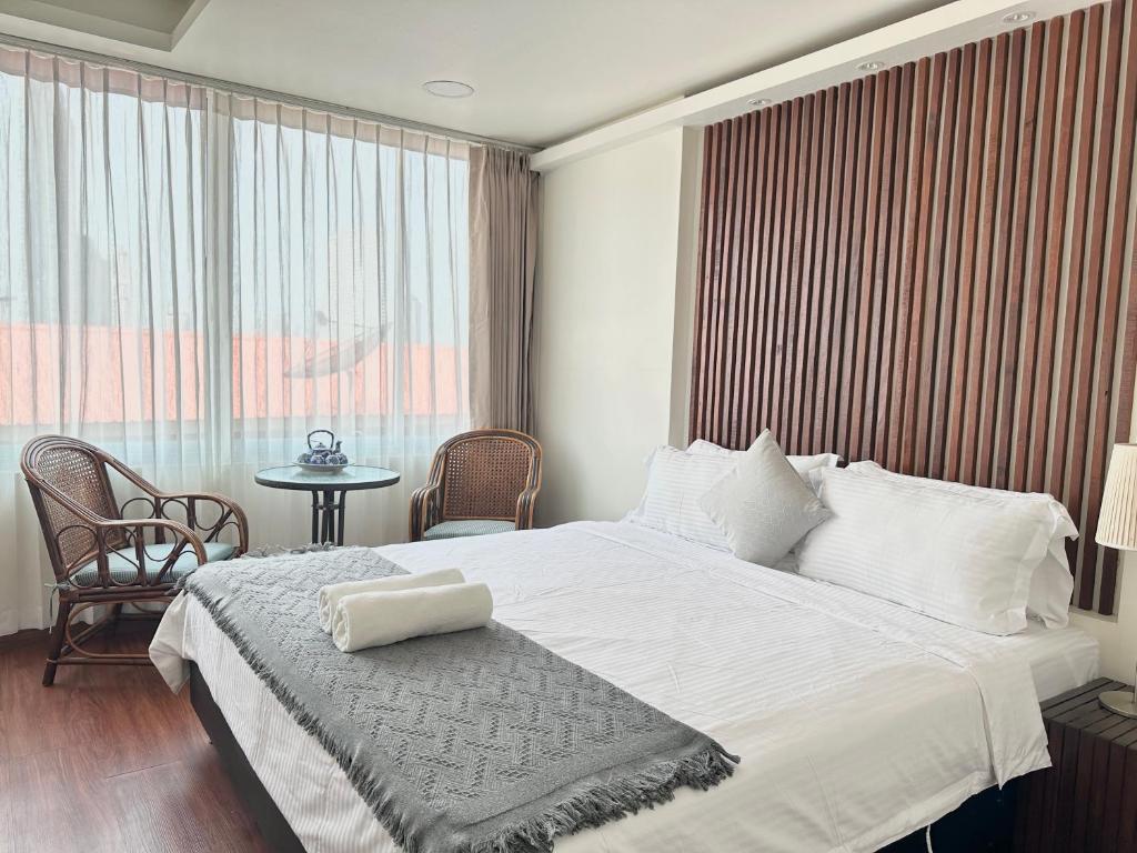 Postel nebo postele na pokoji v ubytování Longzhu Guesthouse
