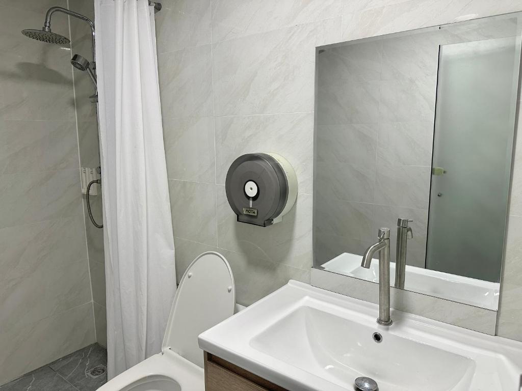 Koupelna v ubytování Longzhu Guesthouse