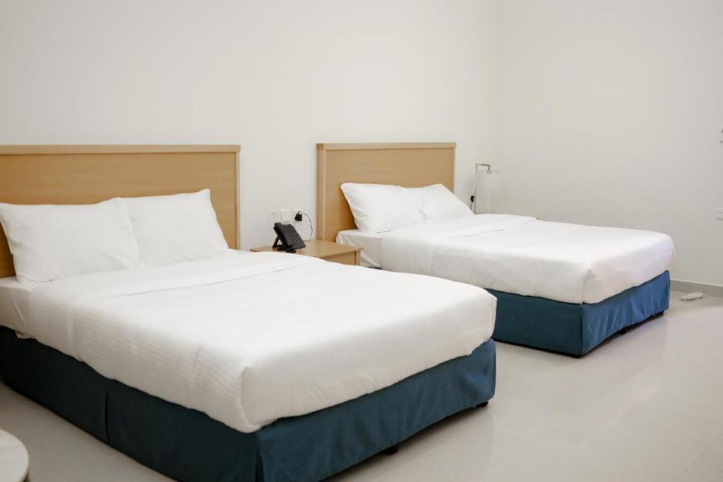 Postel nebo postele na pokoji v ubytování Assia Hotel