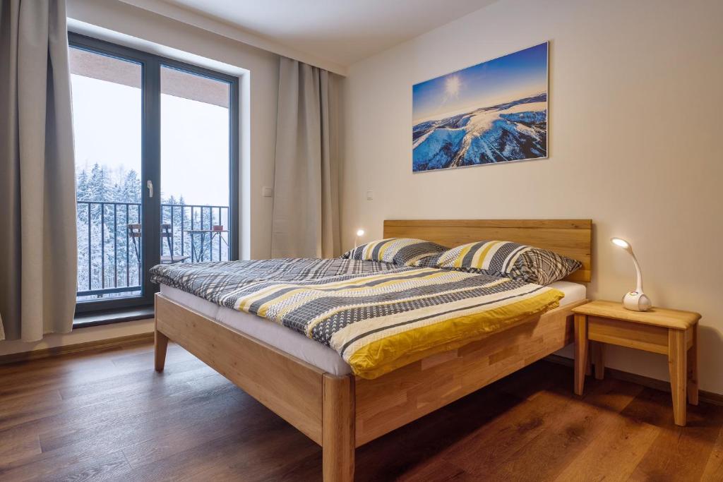 Postel nebo postele na pokoji v ubytování Luční apartmán Jurajda