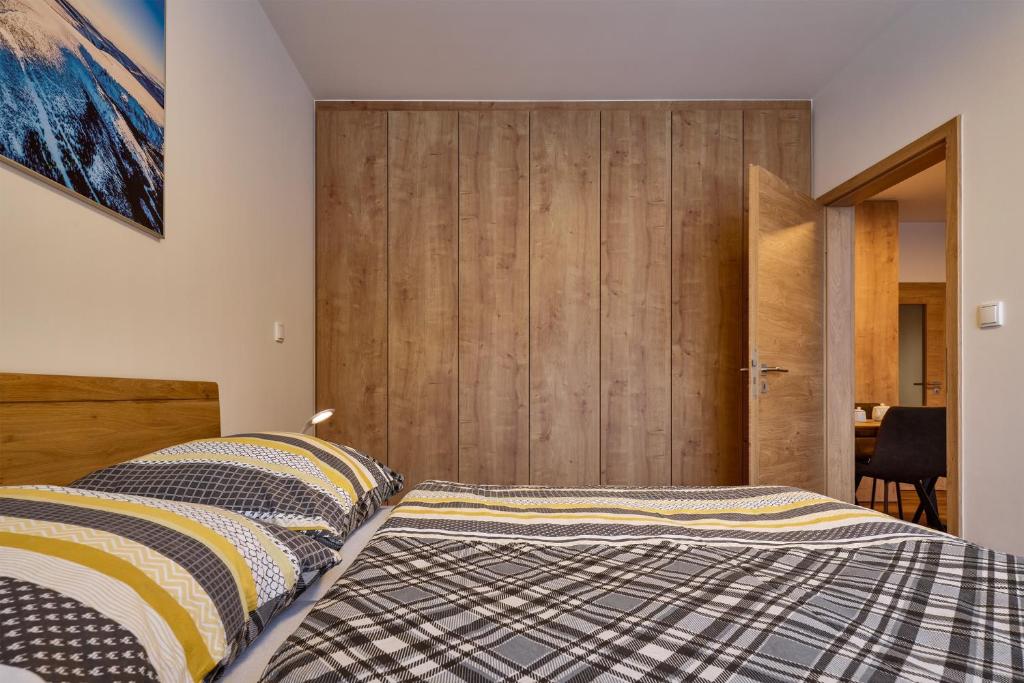 Postel nebo postele na pokoji v ubytování Luční apartmán Jurajda