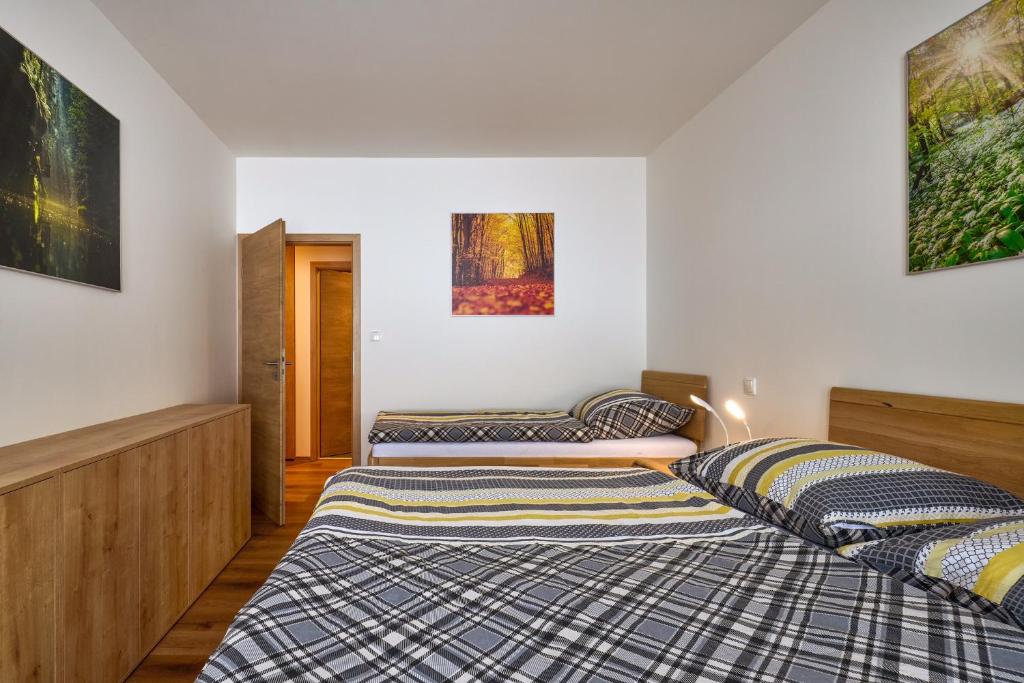 Postel nebo postele na pokoji v ubytování Luční apartmán Jurajda