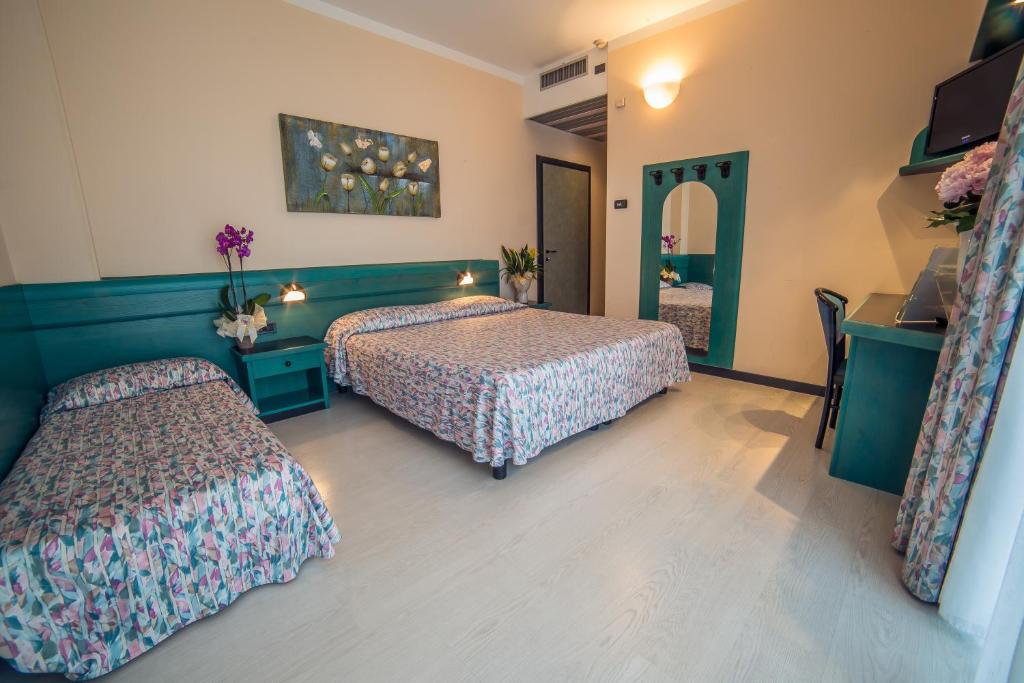 Postel nebo postele na pokoji v ubytování Hotel Eden