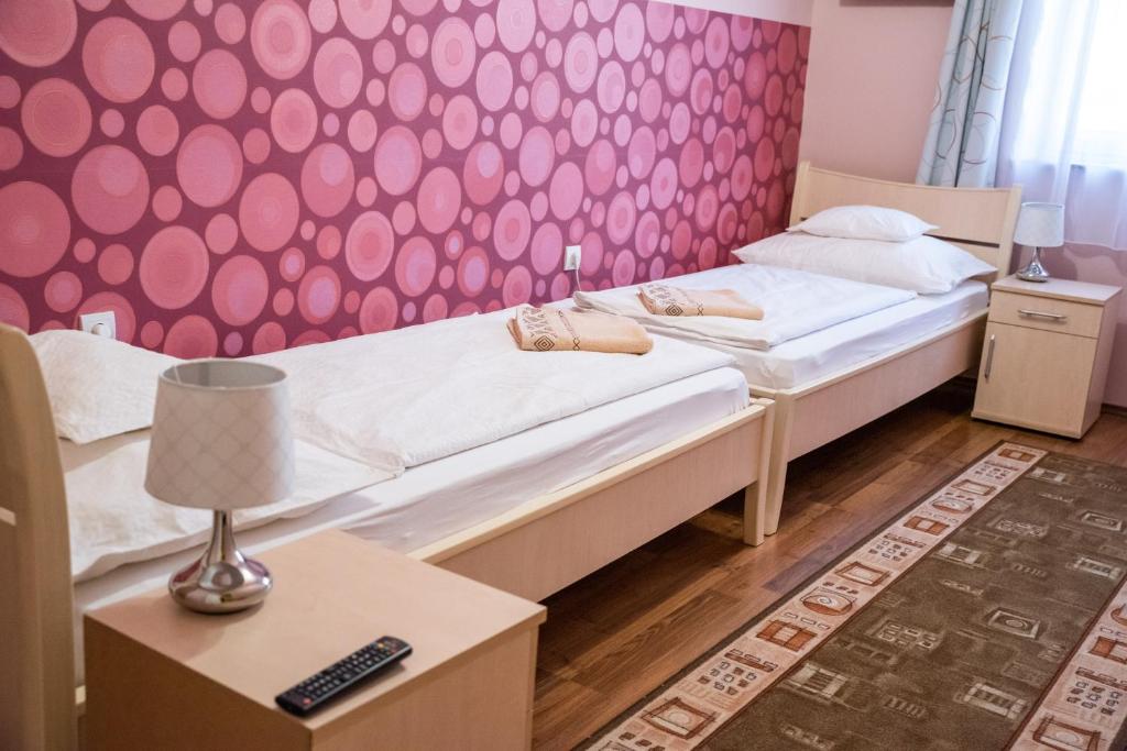 Postel nebo postele na pokoji v ubytování Gesztenye Apartman