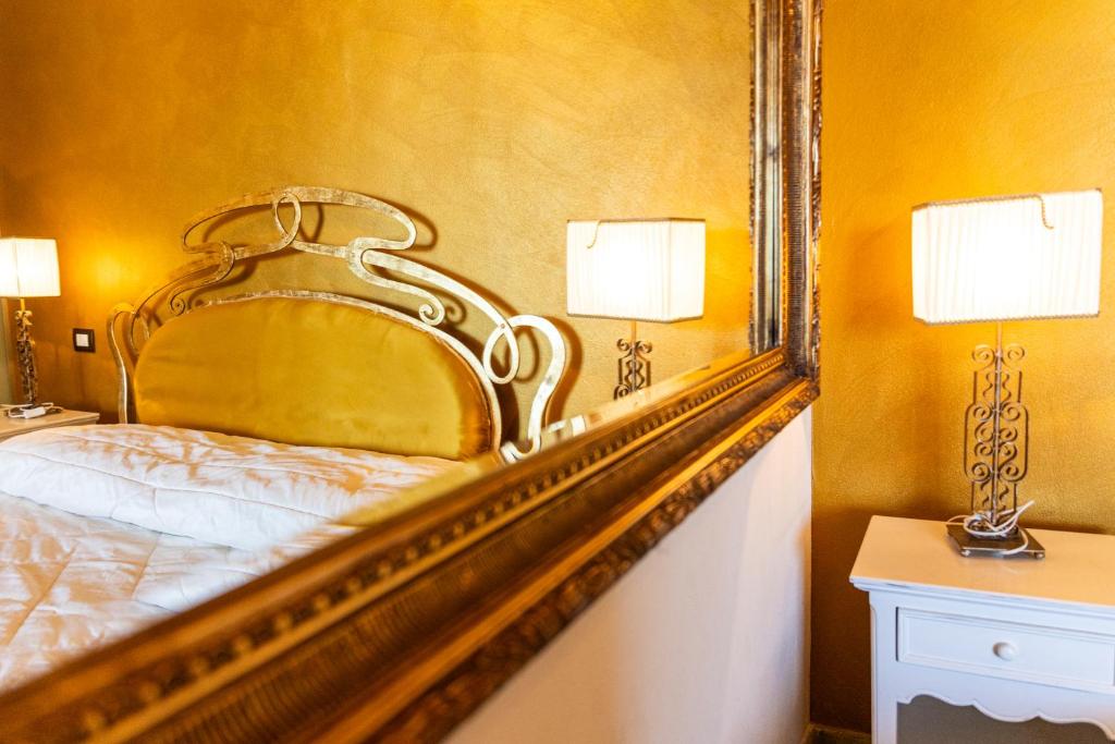 Postel nebo postele na pokoji v ubytování Self Palazzo Aurora