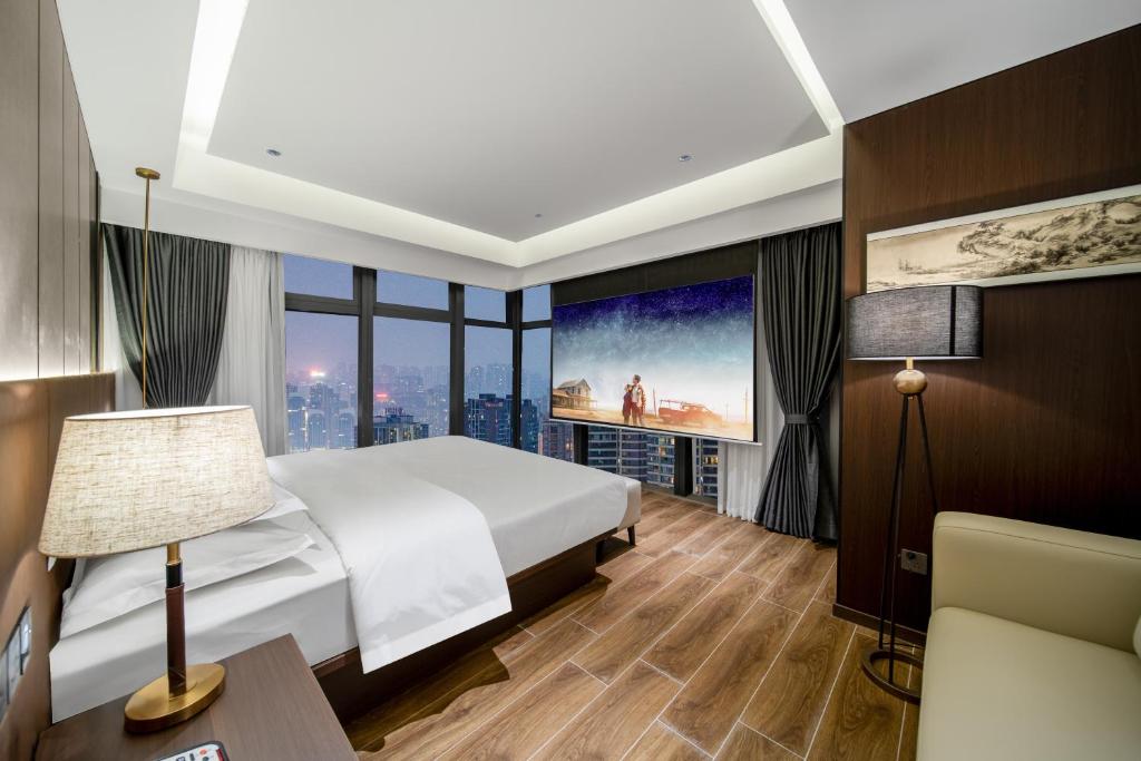 Postel nebo postele na pokoji v ubytování Chongqing Junsheng Yunduan Riverview Hotel