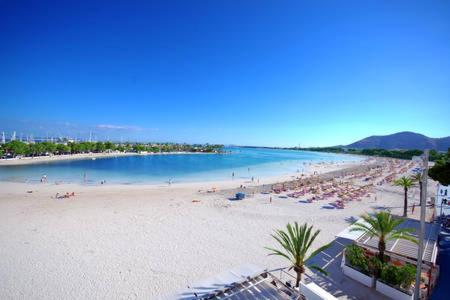 a beach with a lot of people on it at Apartment Alcudia Beach 501 in Port d'Alcudia