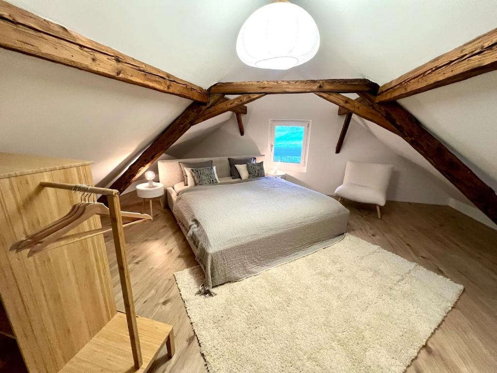 Postel nebo postele na pokoji v ubytování Maison Verdeau Ferien am Murtensee