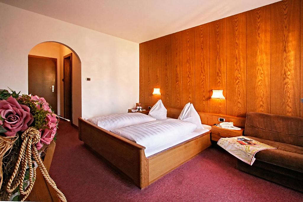 Postel nebo postele na pokoji v ubytování Hotel Schönbrunn