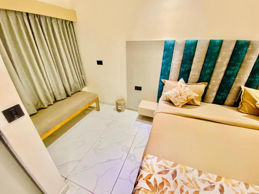 Postel nebo postele na pokoji v ubytování Hotel RV Residency