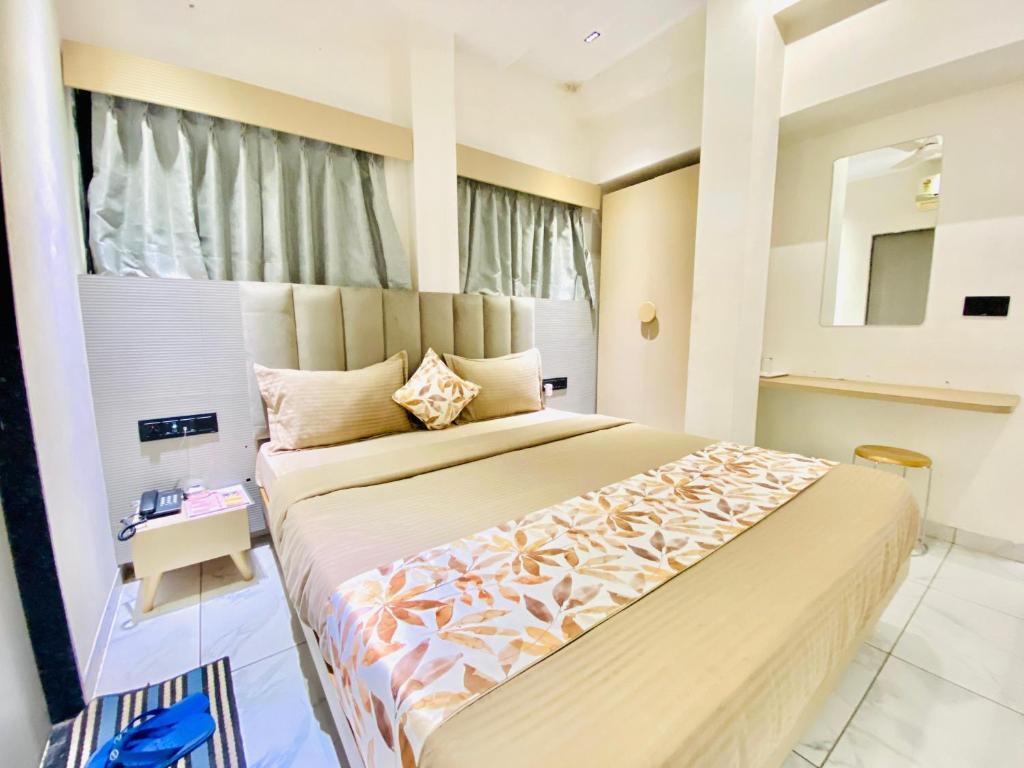 Postel nebo postele na pokoji v ubytování Hotel RV Residency