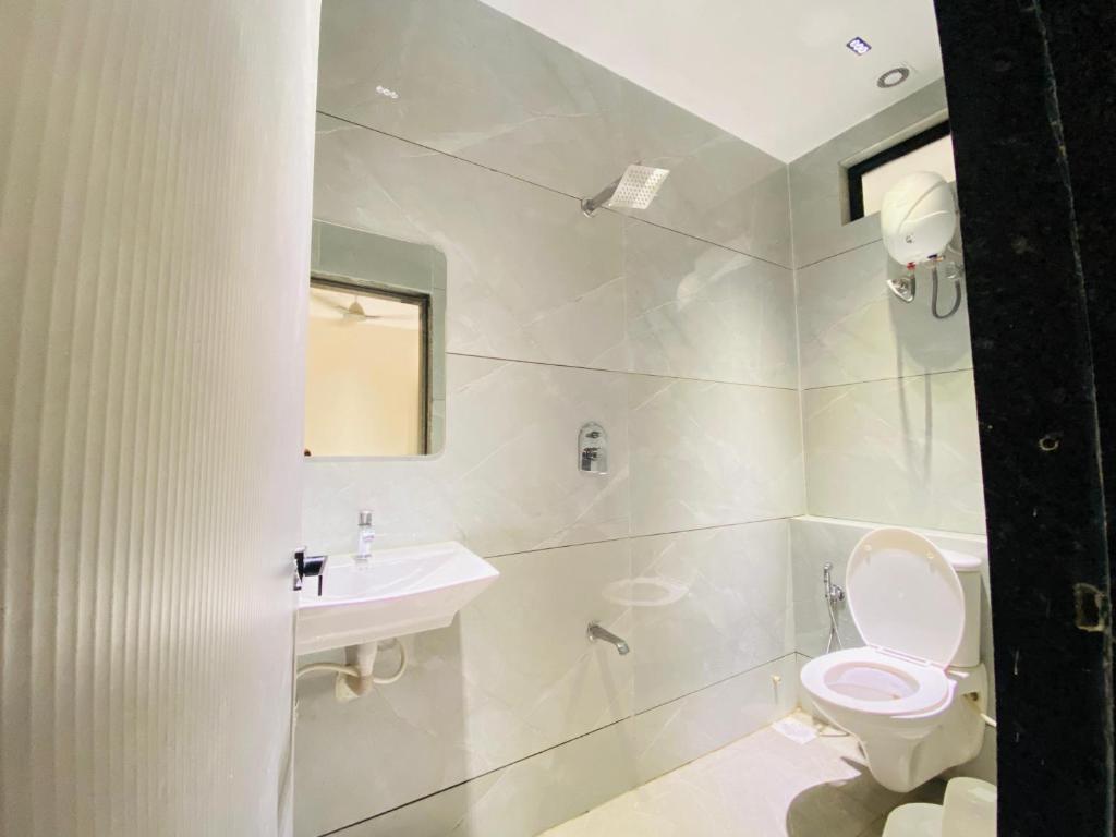Koupelna v ubytování Hotel RV Residency