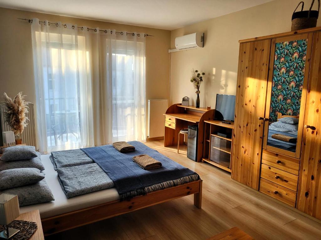 Postel nebo postele na pokoji v ubytování Holiday Home & Apartment