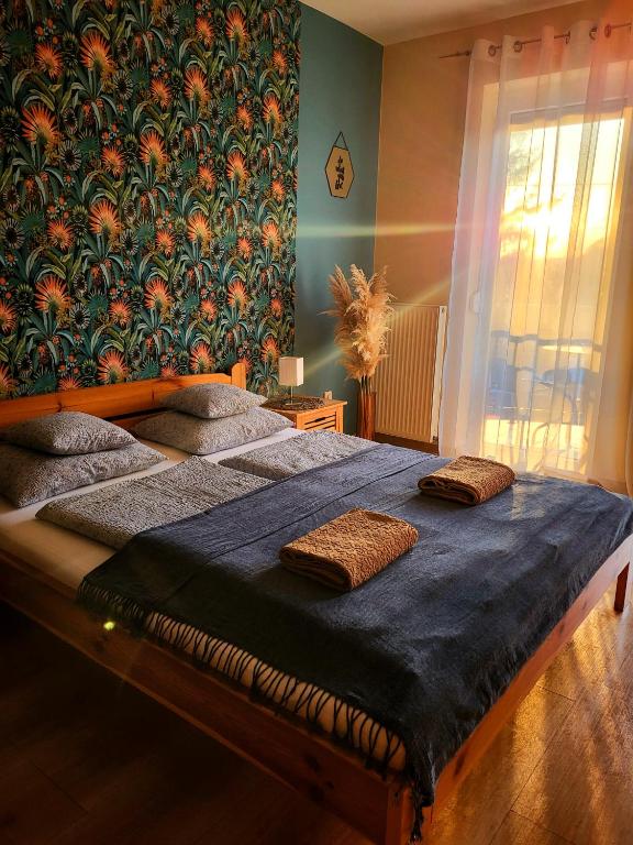Postel nebo postele na pokoji v ubytování Holiday Home & Apartment
