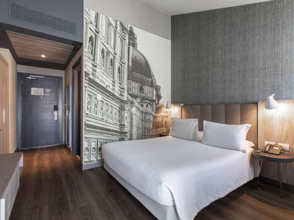 Postel nebo postele na pokoji v ubytování Mercure Firenze Centro