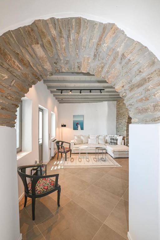 a large living room with a stone ceiling at Stone Grey Arnados in Arnados