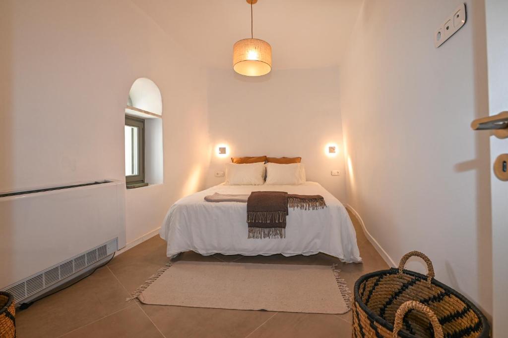 En eller flere senge i et værelse på Stone Grey Arnados