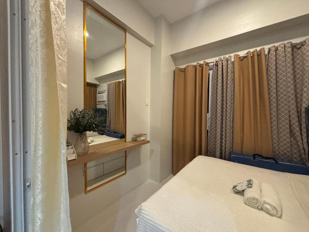 Postel nebo postele na pokoji v ubytování JeeCee Homes in Mactan Lapu-Lapu Cebu
