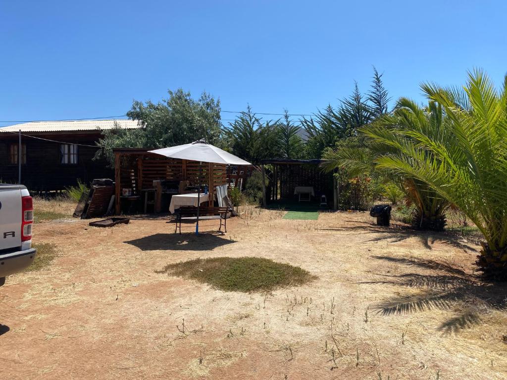 Zahrada ubytování Cabaña con Piscina Guanaqueros
