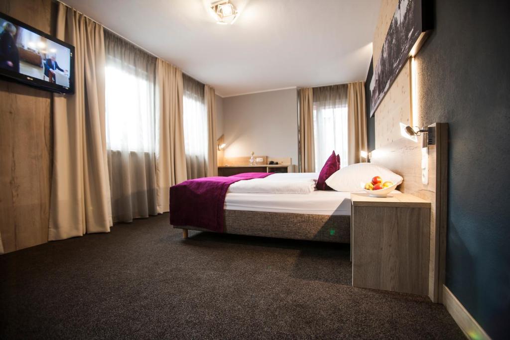 Postel nebo postele na pokoji v ubytování Amalienburg - Boutique & Boarding Hotel