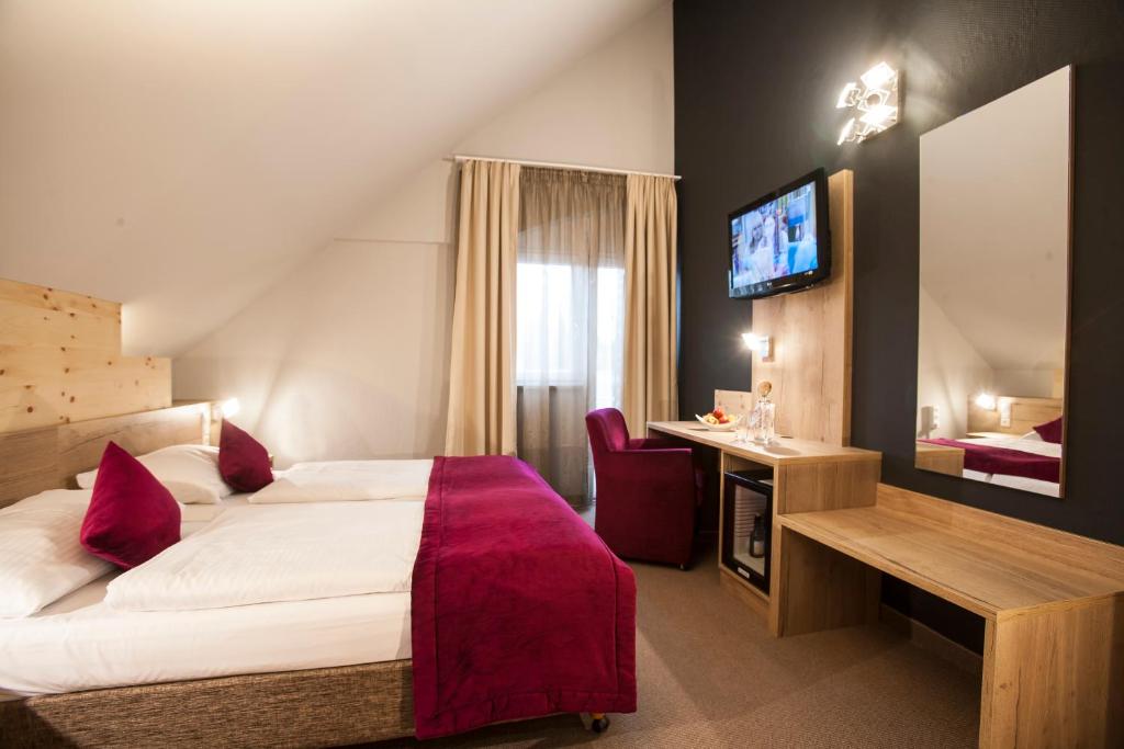 Postel nebo postele na pokoji v ubytování Amalienburg - Boutique & Boarding Hotel