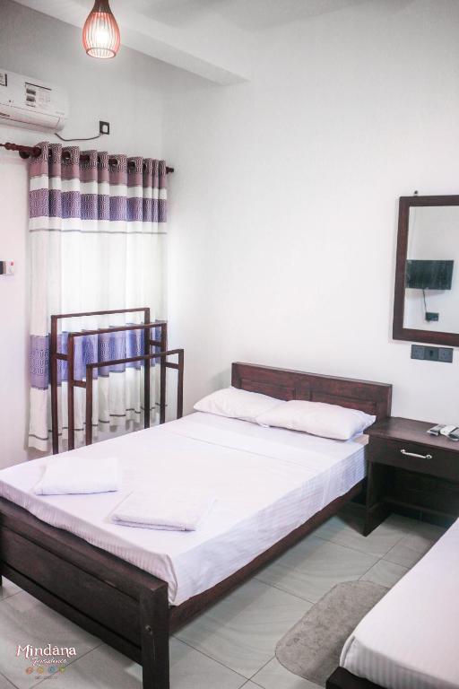 Postel nebo postele na pokoji v ubytování Mindana Residence