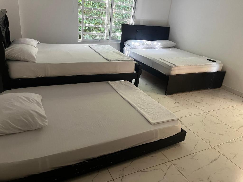 Voodi või voodid majutusasutuse Hotel Tayrona Bahia Concha1 toas