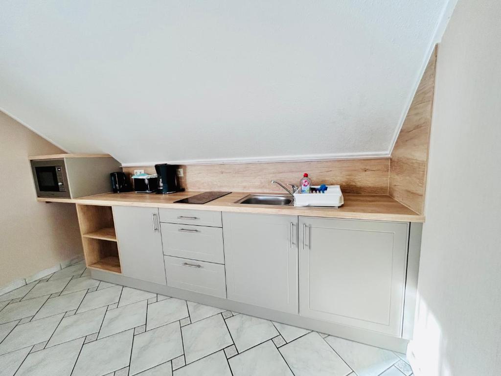 Kuchyň nebo kuchyňský kout v ubytování Nemes Apartmanház