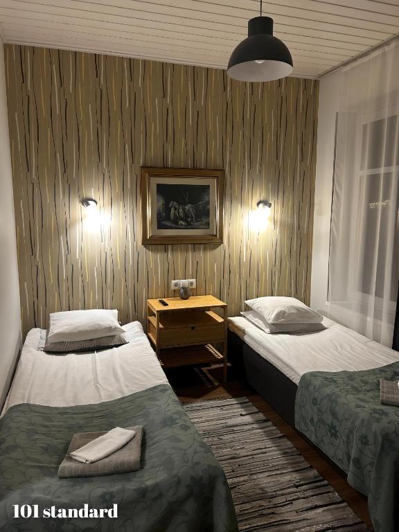 Postel nebo postele na pokoji v ubytování Guesthouse Carl Schmidt