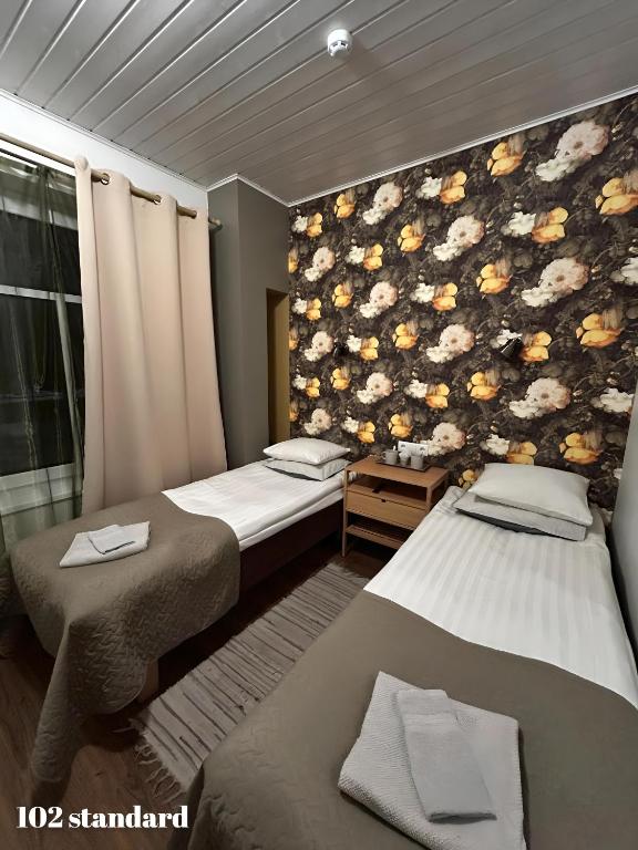 Postel nebo postele na pokoji v ubytování Guesthouse Carl Schmidt