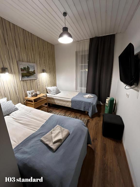 Postel nebo postele na pokoji v ubytování Guesthouse Carl Schmidt