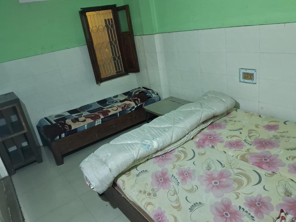 Postel nebo postele na pokoji v ubytování Hotel Shah Paradise