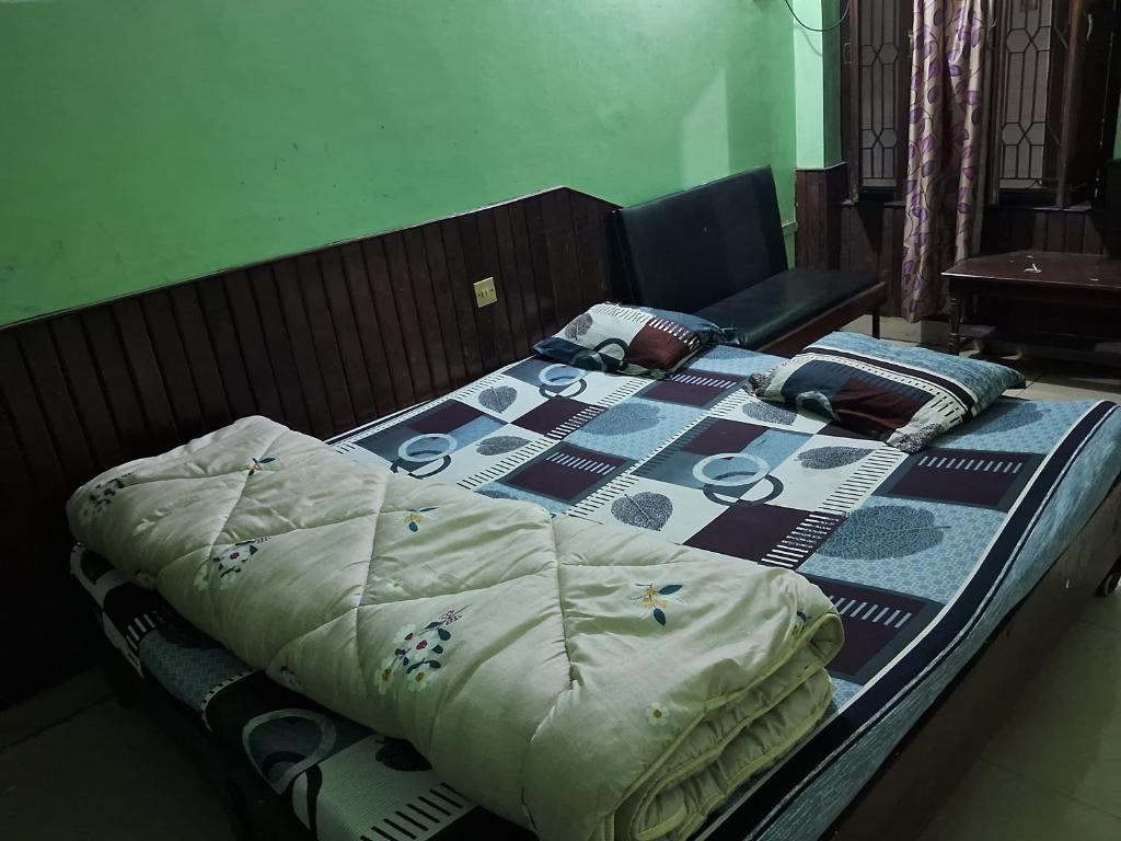 Postel nebo postele na pokoji v ubytování Hotel Shah Paradise