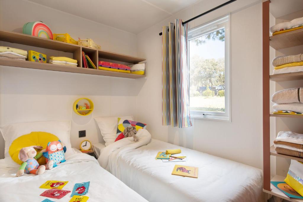 Postel nebo postele na pokoji v ubytování Eco-Lodge Lou Pantaï