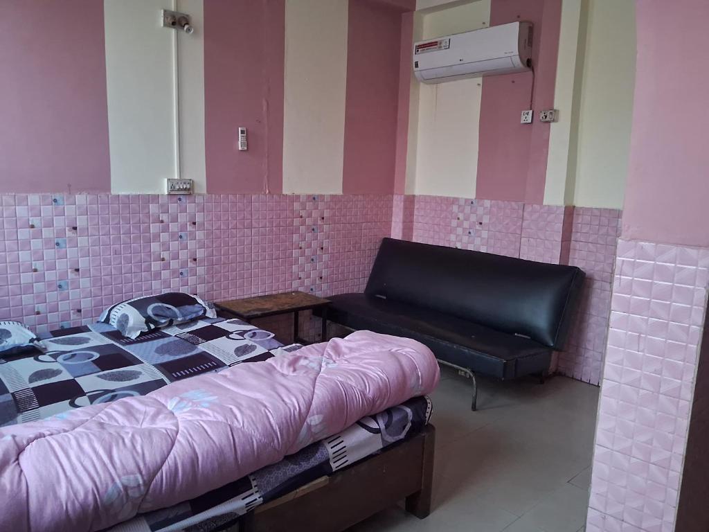 Postel nebo postele na pokoji v ubytování Hotel Shah Paradise