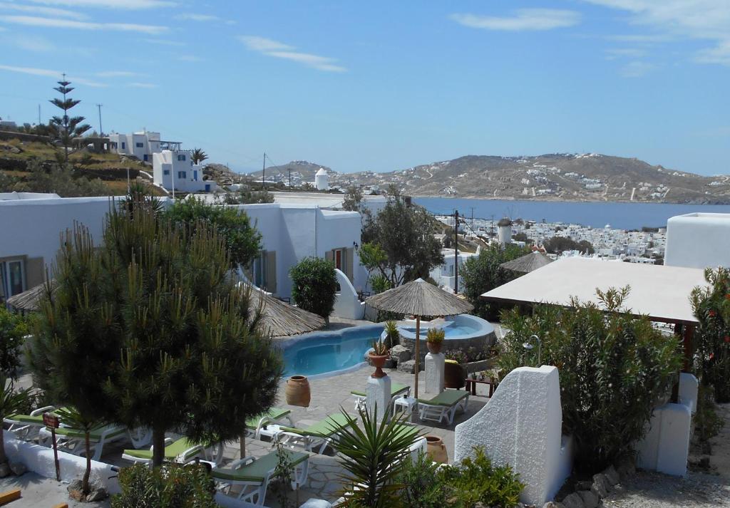 a view of a resort with a swimming pool at La Veranda of Mykonos Traditional Guesthouse in Mýkonos City