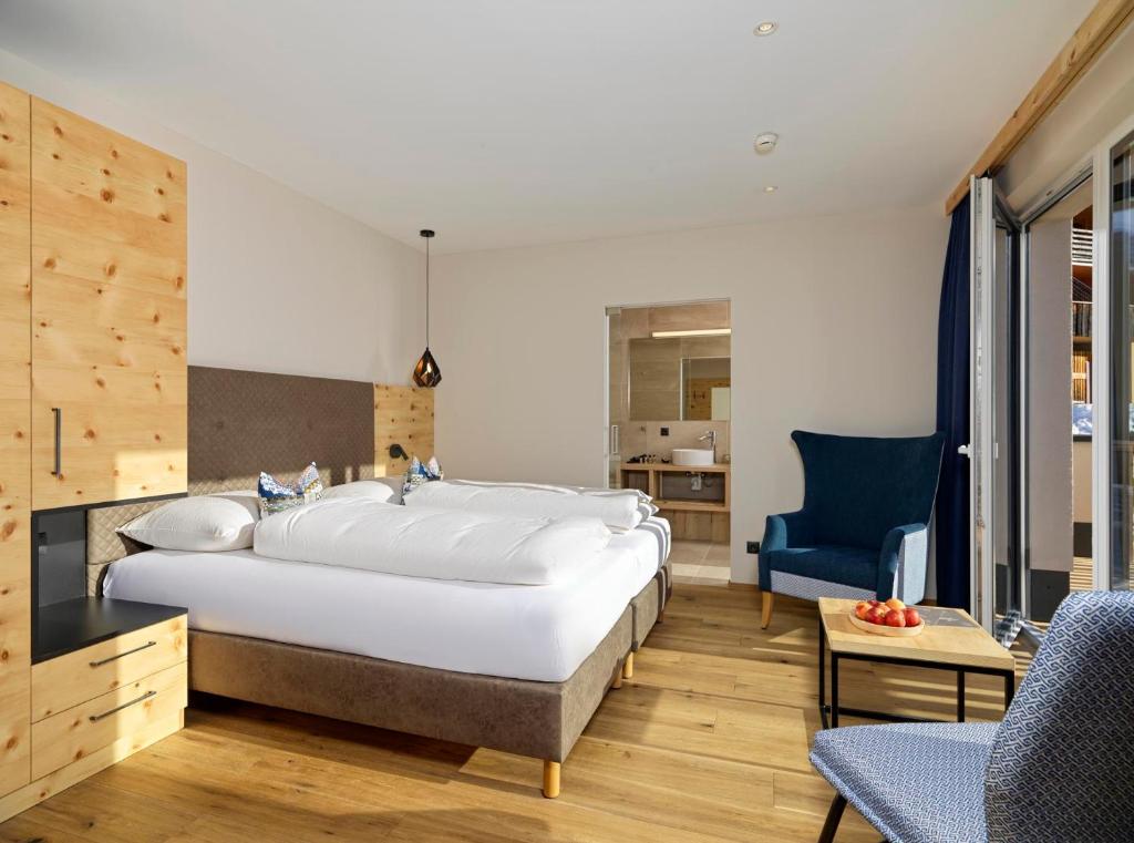 Ein Bett oder Betten in einem Zimmer der Unterkunft Hotel Zirbenhof