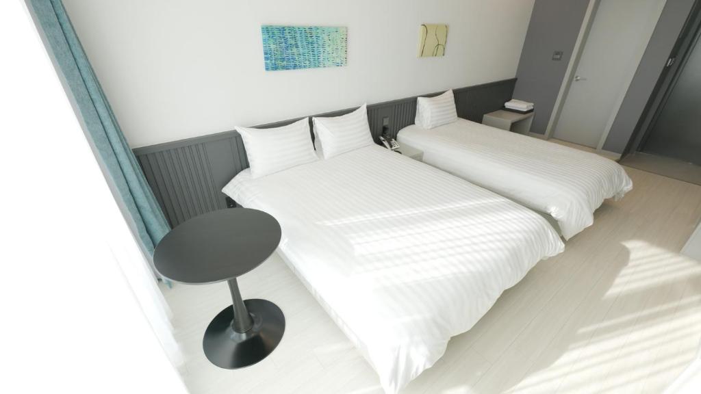 Postel nebo postele na pokoji v ubytování Hotel Sollavue
