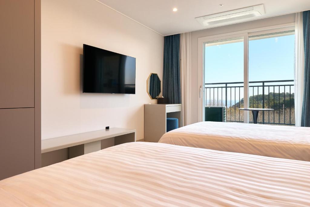 Postel nebo postele na pokoji v ubytování Hotel Sollavue