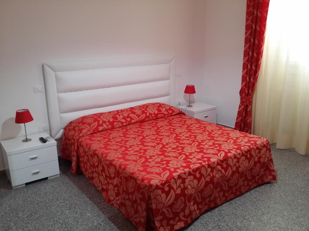 Postel nebo postele na pokoji v ubytování Le Castella B&B Restaurant