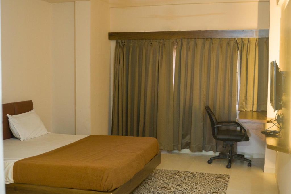 Postel nebo postele na pokoji v ubytování Hotel Ten