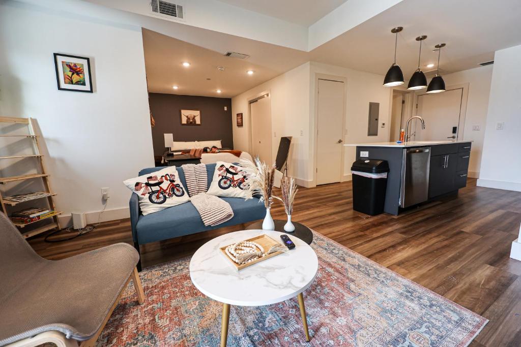 a living room with a couch and a table at Studio Apartment - Inthephiladelphia in Philadelphia