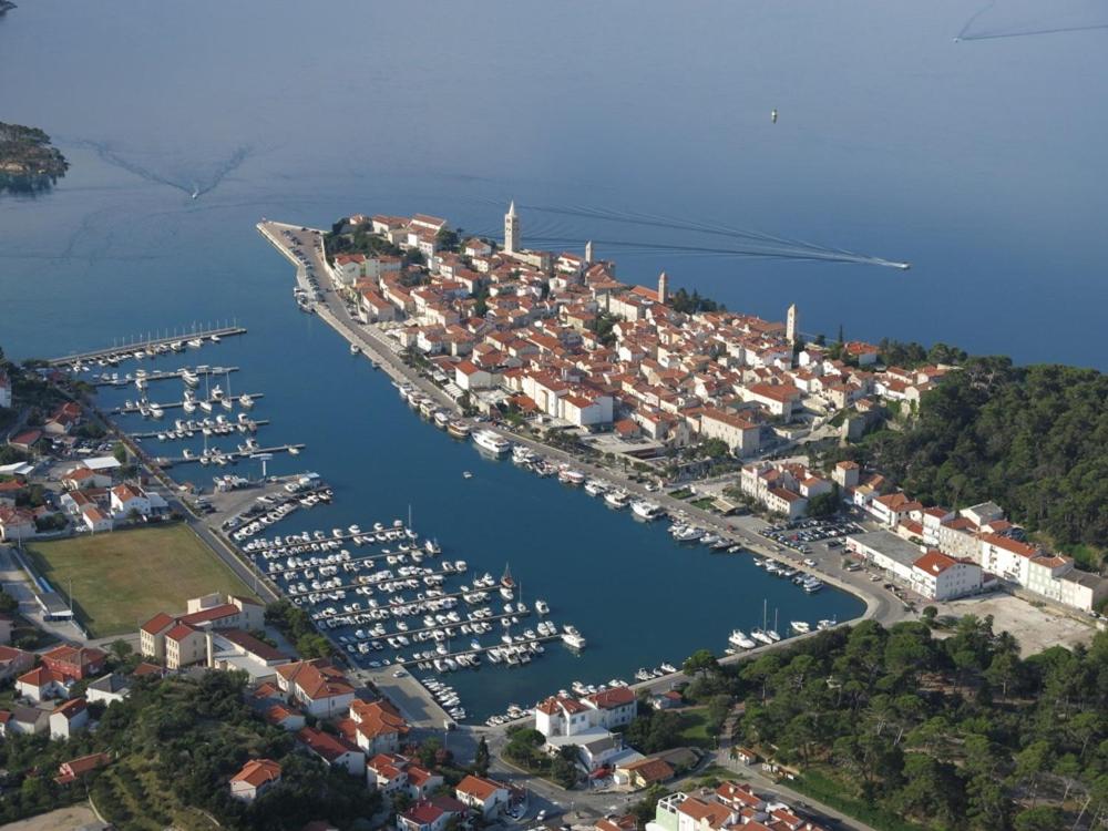 an aerial view of a harbor with boats in the water at Rab From Above Studio Apartment in Rab