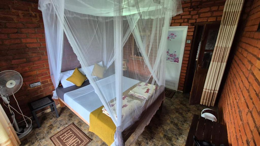 Postel nebo postele na pokoji v ubytování Apurvi Homestay